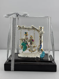 Load image into Gallery viewer, 999 Pure Silver Radha Krishna on Swing Idol 56gm in Protective Acrylic Dome – Divine Couple Murti for Mandir
