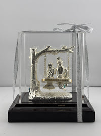 Load image into Gallery viewer, 999 Pure Silver Radha Krishna on Swing Idol 56gm in Protective Acrylic Dome – Divine Couple Murti for Mandir
