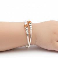 Load image into Gallery viewer, 925 Sterling Silver Baby Kada Pair with Orange Charm Detail
