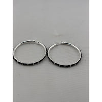 Load image into Gallery viewer, Silver baby bangle pair angled view
