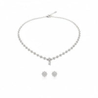 Load image into Gallery viewer, 925 Sterling Silver White CZ Floral Necklace and Earrings
