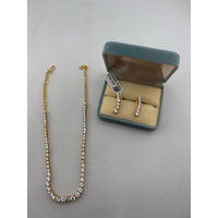 Load image into Gallery viewer, Gold-plated graduated tennis necklace with matching five-stone drop earrings
