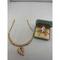 Load image into Gallery viewer, Gold-plated red enamel leaf pendant necklace with matching drop earrings
