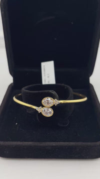 Load and play video in Gallery viewer, 925 Sterling Silver Gold Plated Double Solitaire CZ Open Bangle Bracelet
